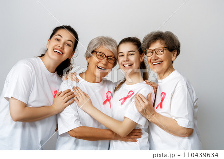 Smiling women with pink satin ribbon 110439634