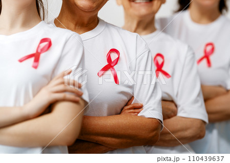 Smiling women with pink satin ribbon 110439637