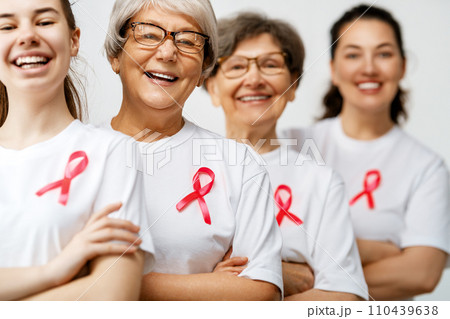 Smiling women with pink satin ribbon 110439638