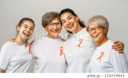 Smiling women with pink satin ribbon 110439641