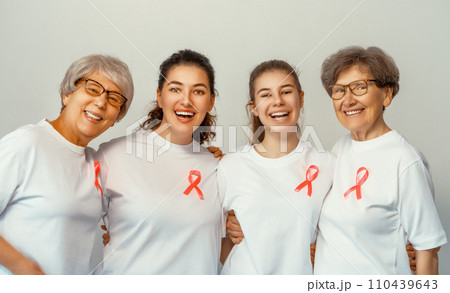 Smiling women with pink satin ribbon 110439643