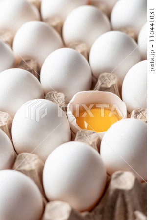 Whole white eggs on egg tray close up. Set of healthy broiler eggs. Pattern 110441031