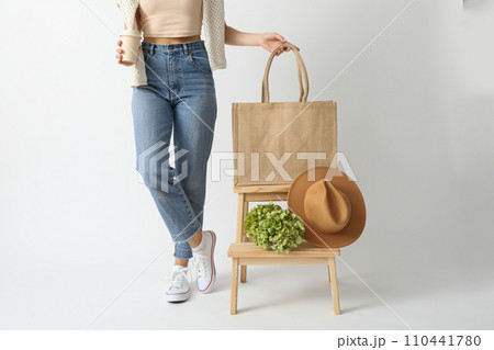 A bag with a hat on a wooden chair A bag with a hat on a wooden chair 110441780