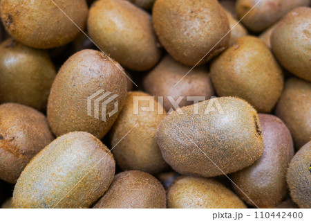 Kiwi fruit close up in the store, fresh and juicy green kiwifruit as background 110442400