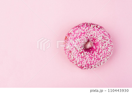 Pink donut on color background, flat lay, top view Pink donut on color background, flat lay, top view 110443930