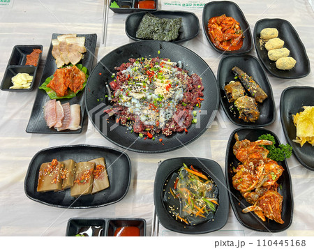 Korean food. Sliced raw beef and live octopus 110445168