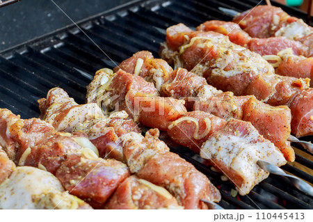Juicy slices of meat cooking meat slices fire 110445413