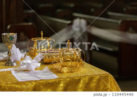 Crowns of gold for the wedding on the table the church. Crowns of gold for the wedding on the table the church. 110445440