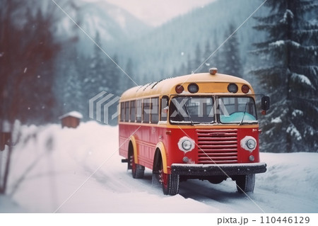 A yellow school bus in the snow rides on a snowy winter road. Safe social assistance for children. 110446129