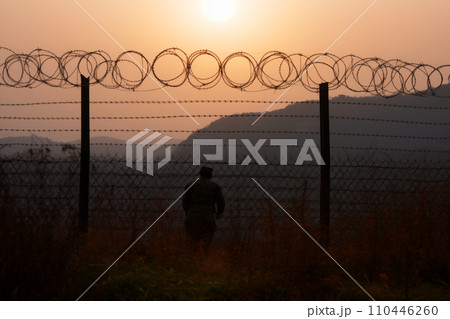 Border of South Kore and North Korea. Border with barbed wire on fence. Border of South Kore and North Korea. Border with barbed wire on fence. 110446260
