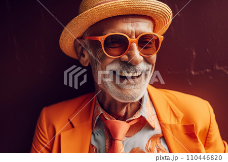 Elderly man with a cheerful smile. Grandfather in glasses and fashionable clothes on vacation. 110446820
