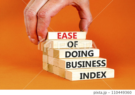 Ease of doing business index symbol. Concept words Ease of doing business index on wooden blocks. Beautiful orange table orange background. Business, ease of doing business index concept. Copy space. Ease of doing business index symbol. Concept words Ease of doing business index on wooden blocks. Beautiful orange table orange background. Business, ease of doing business index concept. Copy space. 110449360
