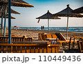 couple walking in Spille beach during sunset in Albania  110449436