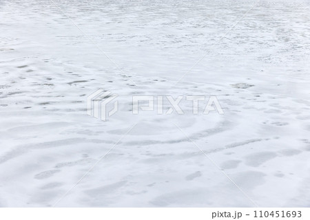Ice and snow covering frozen river in winter season, background photo Ice and snow covering frozen river in winter season, background photo 110451693