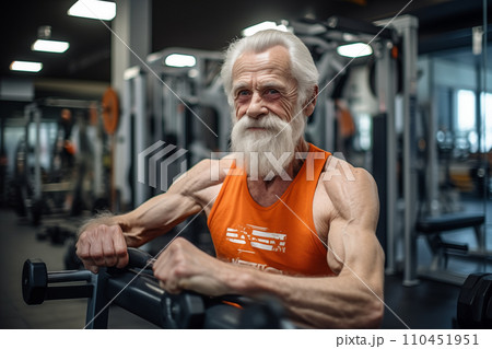 Elderly pensioner old man smiling in gym. 60-70 Year Old Bodybuilder. 110451951