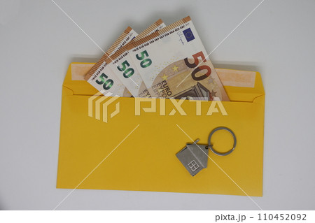 banknotes in a yellow envelope. open envelope with banknotes on a light background. envelope with banknotes. close up of an envelope with cash. international currency banknote. Euro dollars rubles. banknotes in a yellow envelope. open envelope with banknotes on a light background. envelope with banknotes. close up of an envelope with cash. international currency banknote. Euro dollars rubles. 110452092