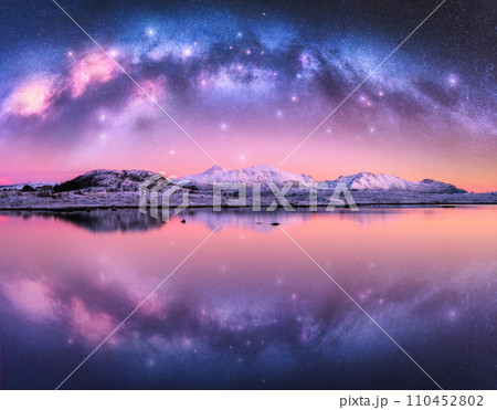 Milky Way arch over snowy mountains and sea coast at winter night 110452802