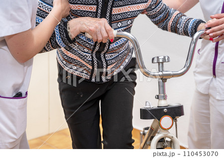Nurse assists her senior patient. Recuperation for elderly, seniors care, nursing home. Nurse assists her senior patient. Recuperation for elderly, seniors care, nursing home. 110453070