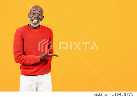 Cheerful senior african american man with beard, hold on hand free space 110458779