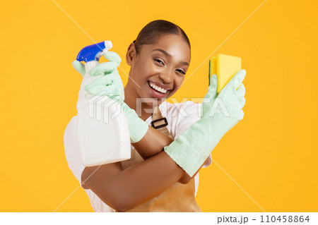 Cheerful Black Woman Professional Cleaner Posing With Household Supplies, Studio Cheerful Black Woman Professional Cleaner Posing With Household Supplies, Studio 110458864