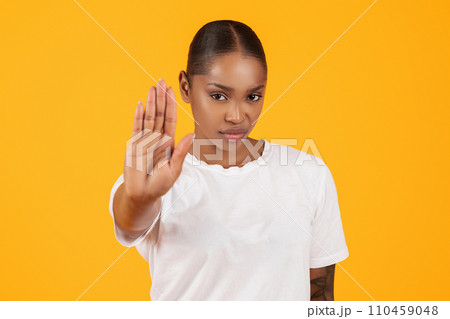 angry african american young woman gesturing stop with hand, studio angry african american young woman gesturing stop with hand, studio 110459048