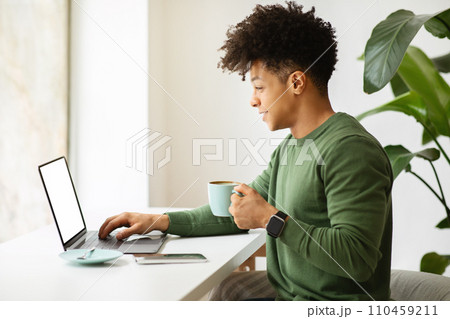 African american man entrepreneur working at cafe, using computer African american man entrepreneur working at cafe, using computer 110459211