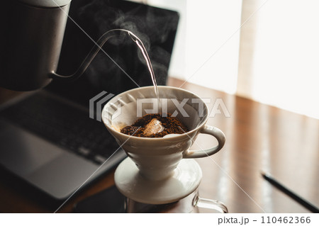 Drip coffee on your work desk in the morning 110462366