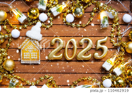 House key with tiny figure of home mock up on festive brown wooden background, lights of garlands. New Year 2025 wooden letters, greeting card. Purchase, construction, relocation, mortgage, insurance House key with tiny figure of home mock up on festive brown wooden background, lights of garlands. New Year 2025 wooden letters, greeting card. Purchase, construction, relocation, mortgage, insurance 110462919