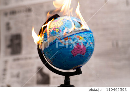 Model globe on fire. Planet Earth Burning. Global Warming and Climate Change Concept. 110463598
