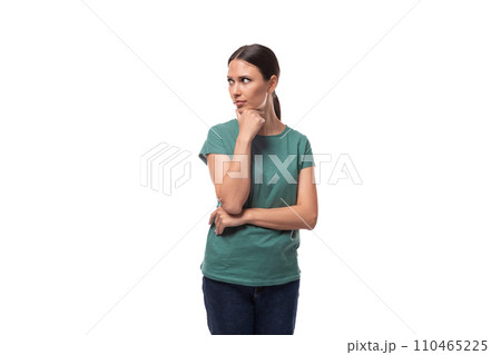 young brunette woman thinking while standing alone young brunette woman thinking while standing alone 110465225