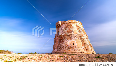 Long Exposure of Ancient Watchtower Under Silky Cloud Sky 110466419