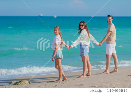 Happy family on the beach during summer vacation 110466613