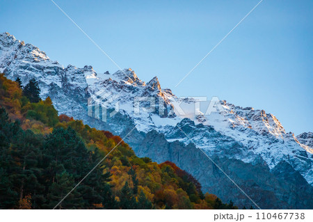 Stunning view of a snow-capped glacier among the mountains 110467738