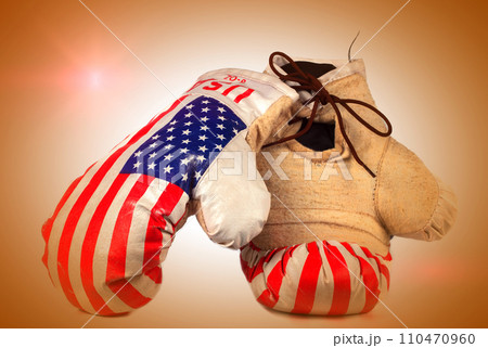 Boxing vintage gloves with USA flag on beige background Boxing vintage gloves with USA flag on beige background 110470960