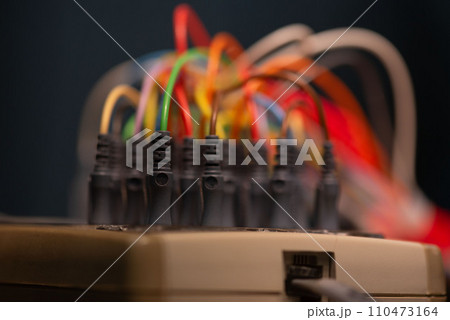 Close-up view of EEG cables plugged-in to the socket 110473164