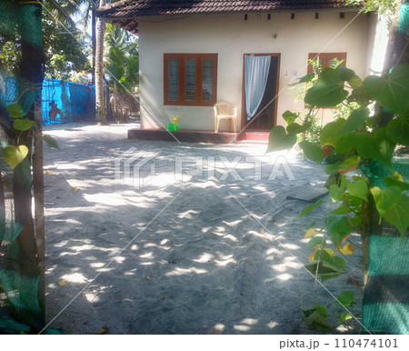 Indian house on shore of Arabian sea. Yard is stretch of beach 110474101