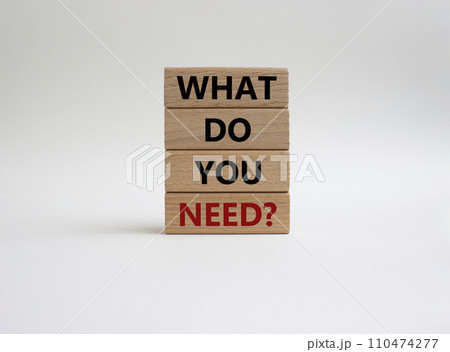 What do you need symbol. Wooden blocks with words What do you need. Beautiful white background. Business and What do you need concept. Copy space. 110474277