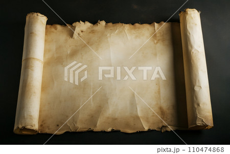 Aged, weathered paper scroll with copy space on a dark backdrop 110474868