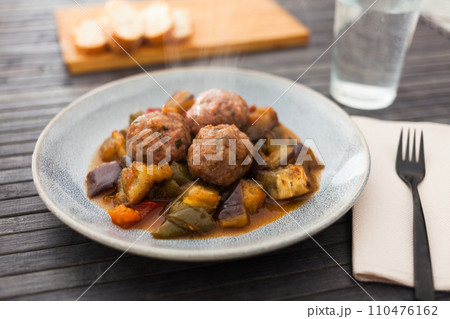 Cooked meatballs with stewed eggplant with haze in bowl Cooked meatballs with stewed eggplant with haze in bowl 110476162
