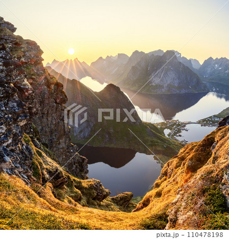 Ethereal light from the midnight sun bathes Reinebringen in a serene glow Ethereal light from the midnight sun bathes Reinebringen in a serene glow 110478198