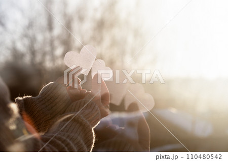 Double exposure of hands with hearts. Double exposure of hands with hearts. 110480542