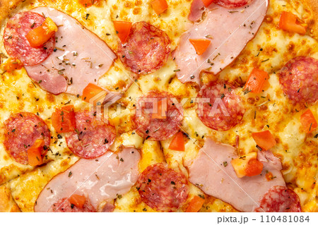 Background with delicious classic italian Pizza Pepperoni with sausages and cheese mozzarella. Background with delicious classic italian Pizza Pepperoni with sausages and cheese mozzarella. 110481084