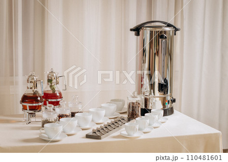Group of empty white ceramic cups for coffee or tea in outside buffet at the business meeting event  110481601