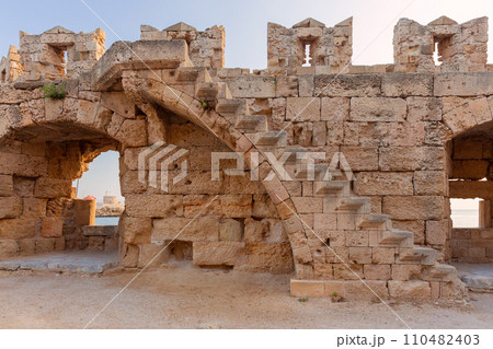 Old stone fortress wall in the city of Rhodes. Old stone fortress wall in the city of Rhodes. 110482403