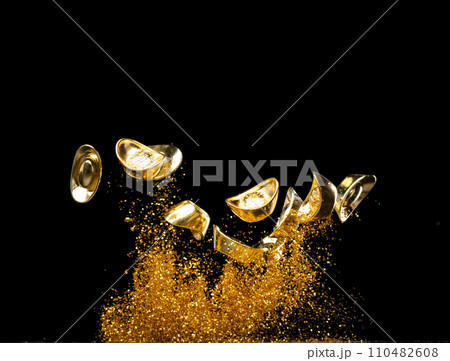Gold Ingot Chinese Money bar token fly with dust particle in air. Chinese new year Yuanbao gold ingots floating to golden money sand particle. Language is wealthy prosperity. Black background isolated Gold Ingot Chinese Money bar token fly with dust particle in air. Chinese new year Yuanbao gold ingots floating to golden money sand particle. Language is wealthy prosperity. Black background isolated 110482608
