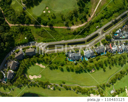 Aerial view of beautiful green golf field fairway and putting green,Top view image for sport background and travel nature background, Amazing green nature view 110483125