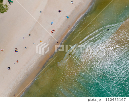 Aerial view of Waves crashing on sandy shore,Sea surface ocean waves background,Top view beach background 110483167