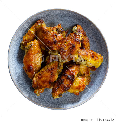 Fried chicken wings served on platter 110483312