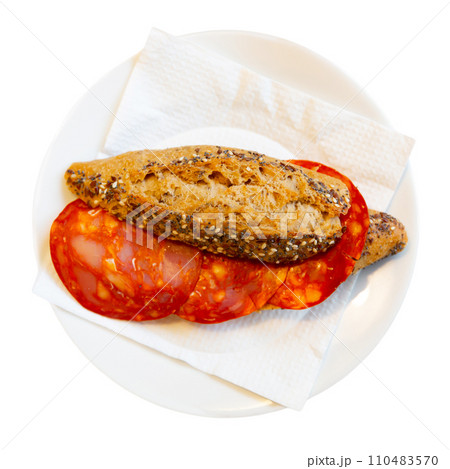 Typical spanish breakfast is smoked sausage sandwich on crispy bun 110483570