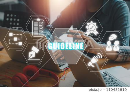 Guideline concept, Business team working on laptop computer on desk with guideline icon on virtual screen. 110483610